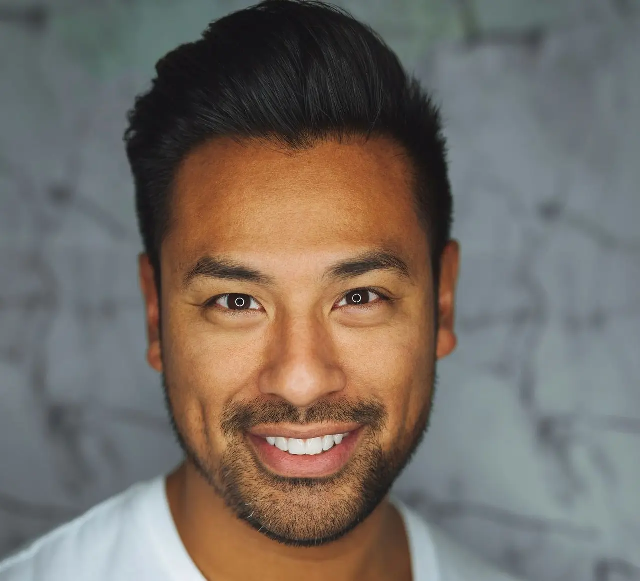 man wearing white V-neck shirt